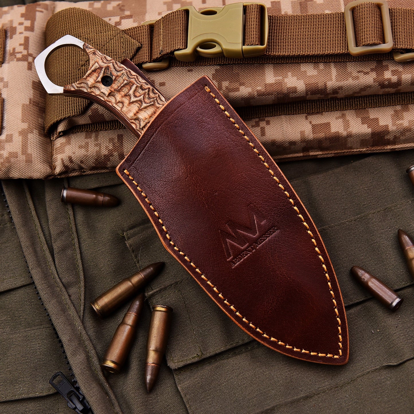 Brown leather knife sheath with stitching detail on a camouflage background with bullets.