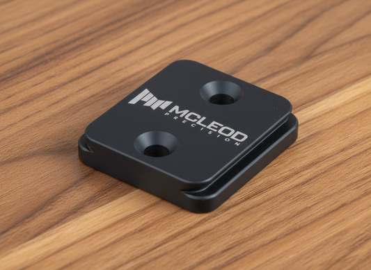Black metal component with 'McLeod Precision' branding on a white background
