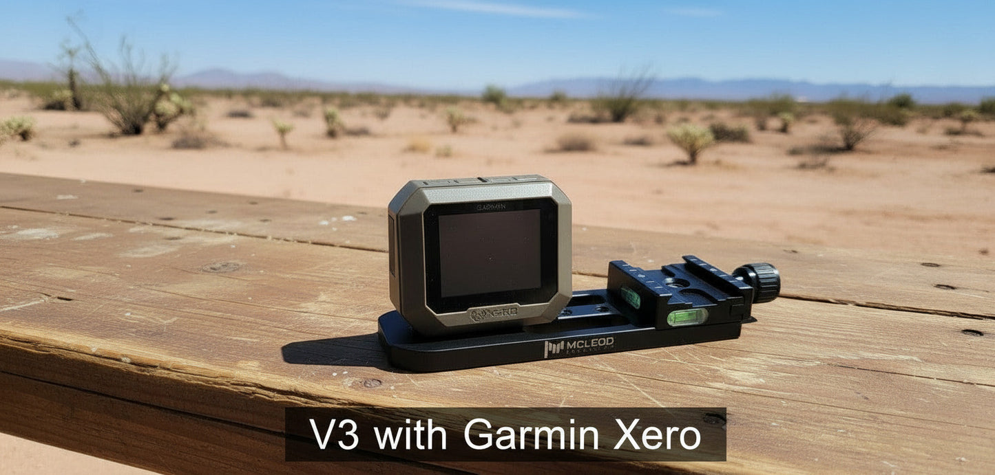 Black electronic device with a screen on a wooden surface