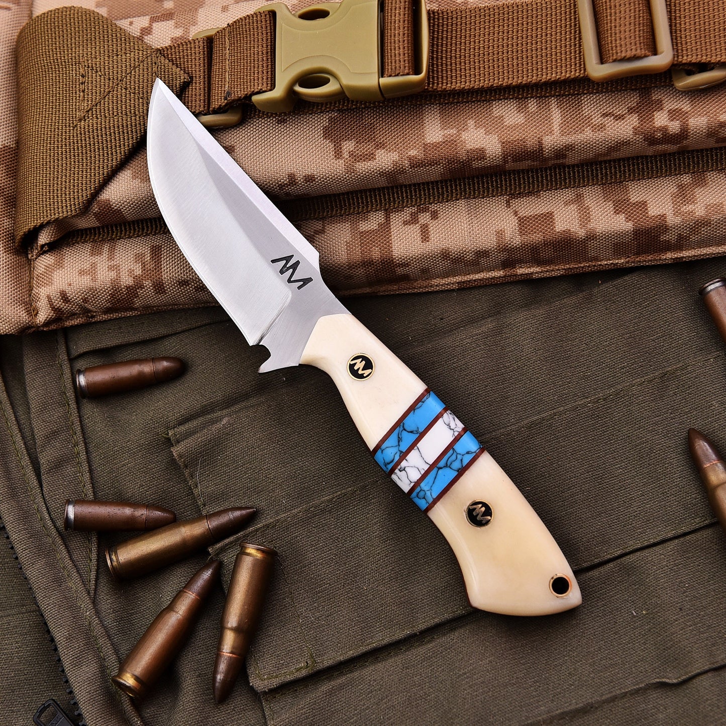 Knife with a decorative handle on military-style clothing with bullets