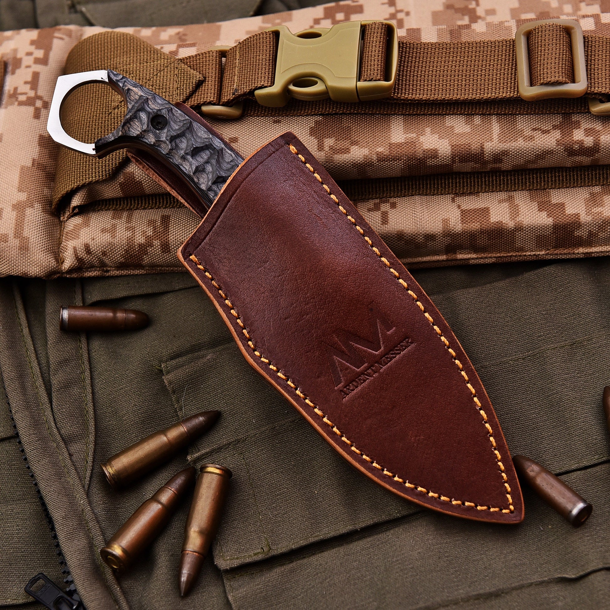 Brown leather knife sheath with a logo on a camouflage background